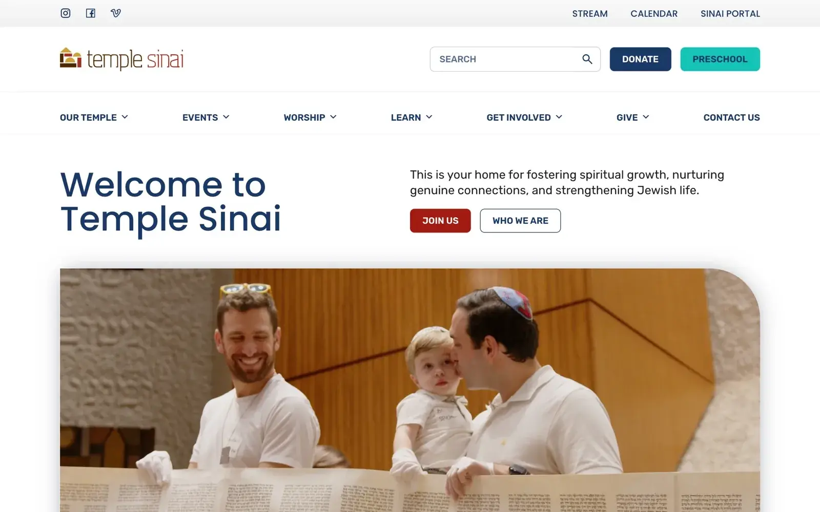Temple Sinai Atlanta homepage reading Welcome to Temple Sinai beside a warm photo of a Torah reading